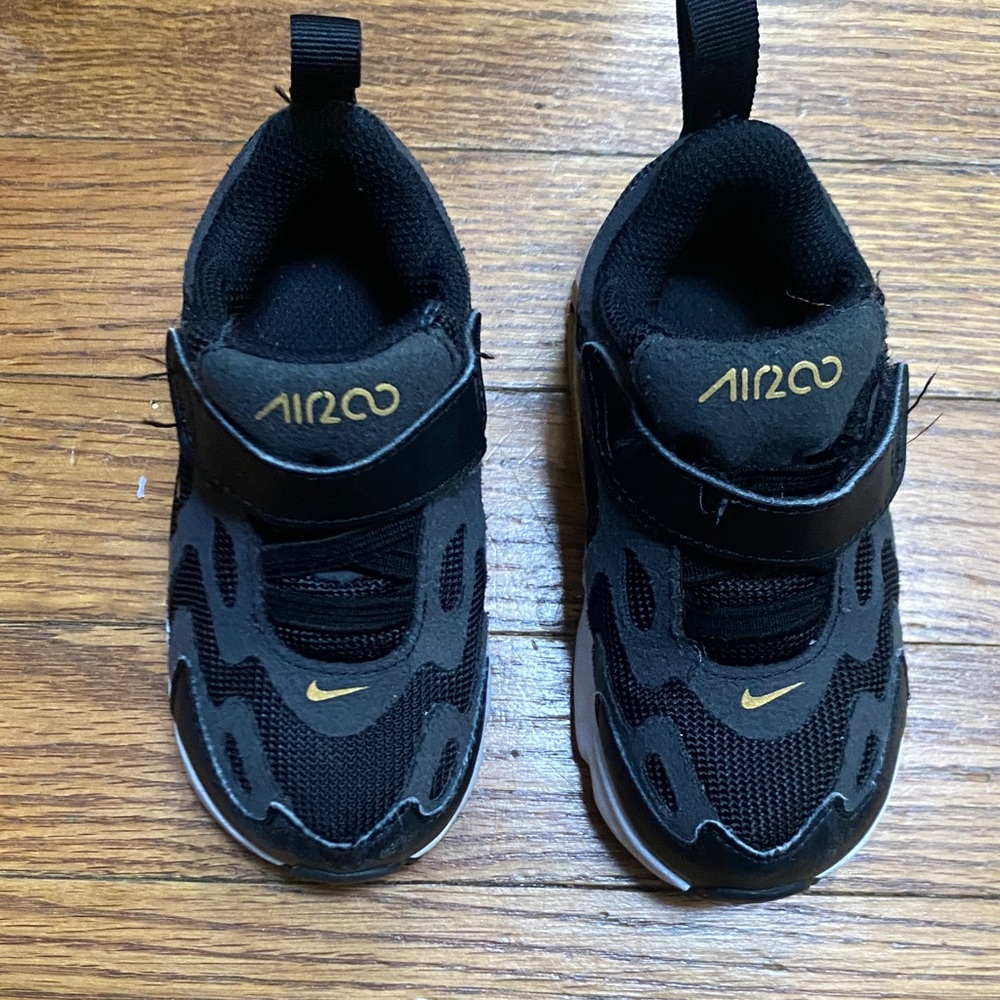 Nike Kids Black Sneakers with Gold Accents